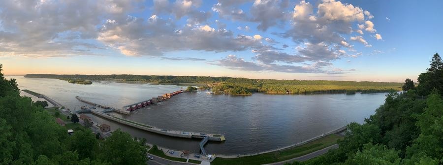 Panoramic view from Eagle Point Park over the Mississippi River and Lock and Dam No. 11 beneath a cloud-filled sky